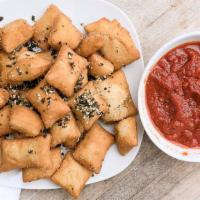 Pizza Pillows · Housemade pizza dough, fried & served with marinara.