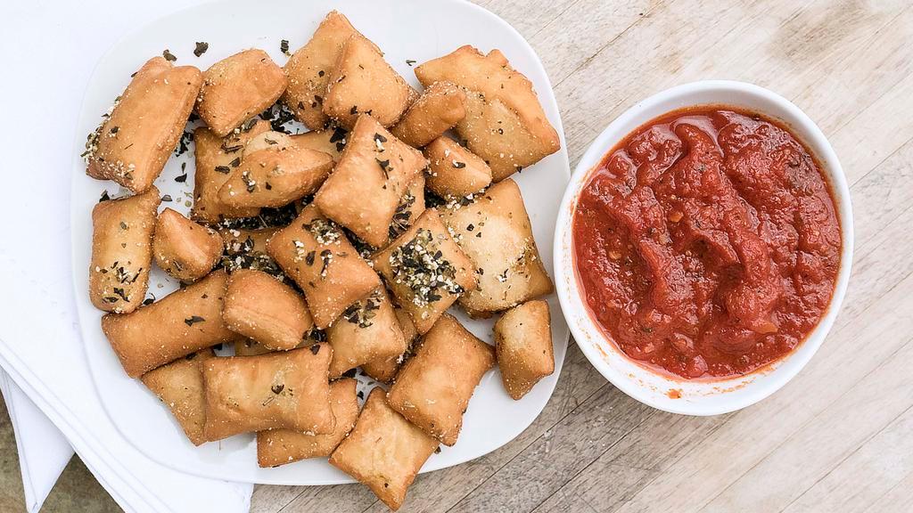 Pizza Pillows · Housemade pizza dough, fried & served with marinara.