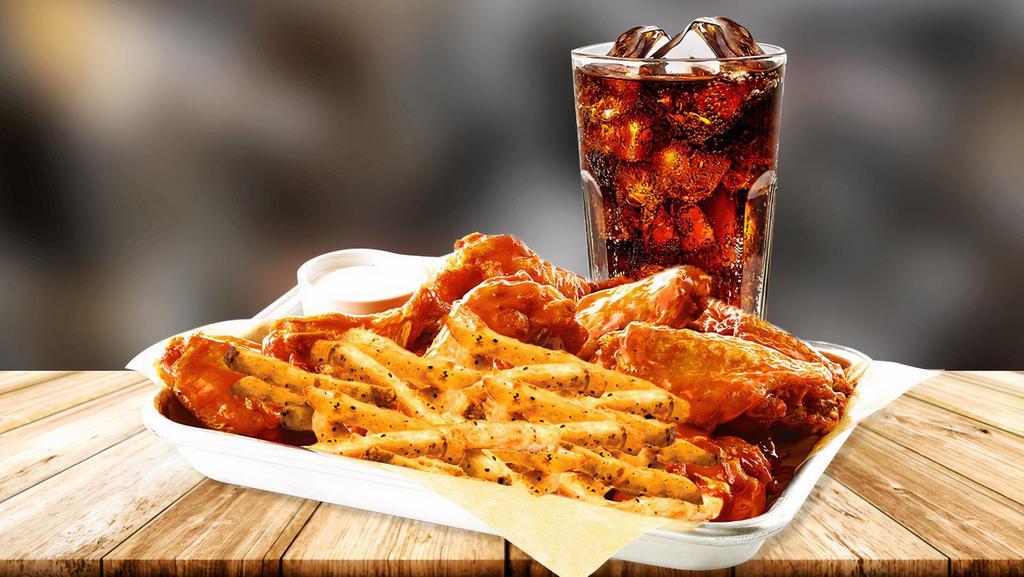 Traditional Wings Combo · Served with fries and a drink. Seasoned to perfection with over 4 sauce and dipping sauce options.