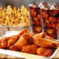 Traditional Wings Party Platter Combo · 20 wings served with two basket fries and 2 drinks. Seasoned to perfection, handspun wings w...