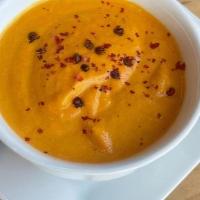 House Made Carrot And Orange Bisque · House made Carrot and Orange bisque, with Star Anise and topped with cracked Red Peppercorn
