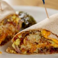 Grand Burrito · Scrambled eggs, grilled bacon, sausage, onions, hash browns, and cheddar cheese rolled in a ...