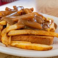 Cowboy  · served open faced over texas toast topped with fries smothered with brown gravy