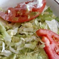 Fresh Guacamole Salad · Lettuce, guacamole and tomatoes.
