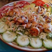 Shrimp Salad · Lettuce, tomatoes, cucumbers, avocado, shredded cheese, and grilled shrimp.