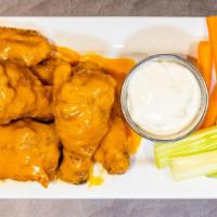 Buffalo Wings · The classic buffalo sauce. Full flavored, but still mild enough for everyone to enjoy. Two s...