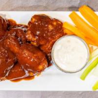 Spicy Bbq Wings · BBQ with a kick! 2 stars of heat in our housemate wing sauce!