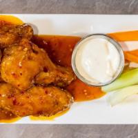 Sweet Chili Wings · Don’t let the name fool you, there’s 4 stars of heat in this deliciously sweet and spicy sau...