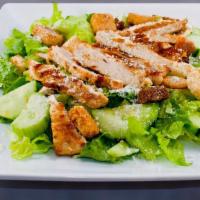 Caesar Salad · Crisp romaine lettuce topped with croutons, Parmesan cheese, and our special house dressing.