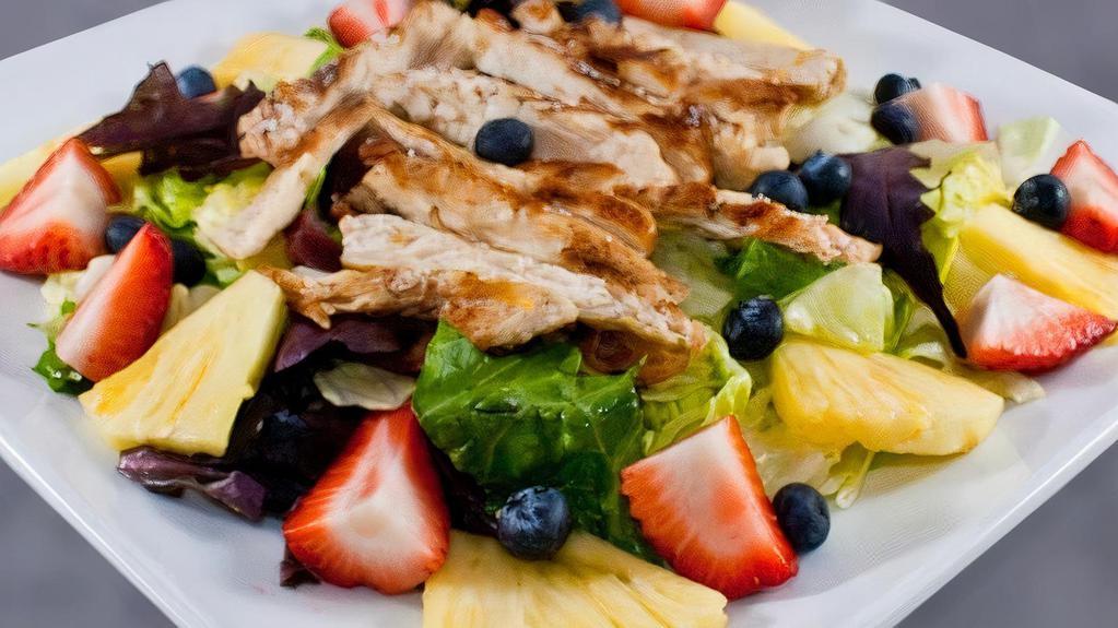 Chicken Summer Salad · Boneless chicken breast on top of fresh strawberries, blueberries, pineapple, and romaine lettuce with raspberry dressing.