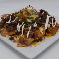 Mexican Nachos · Your choice of  grilled meat, cheese, sour cream, beans, steak,,chicken or pastor & pico de ...