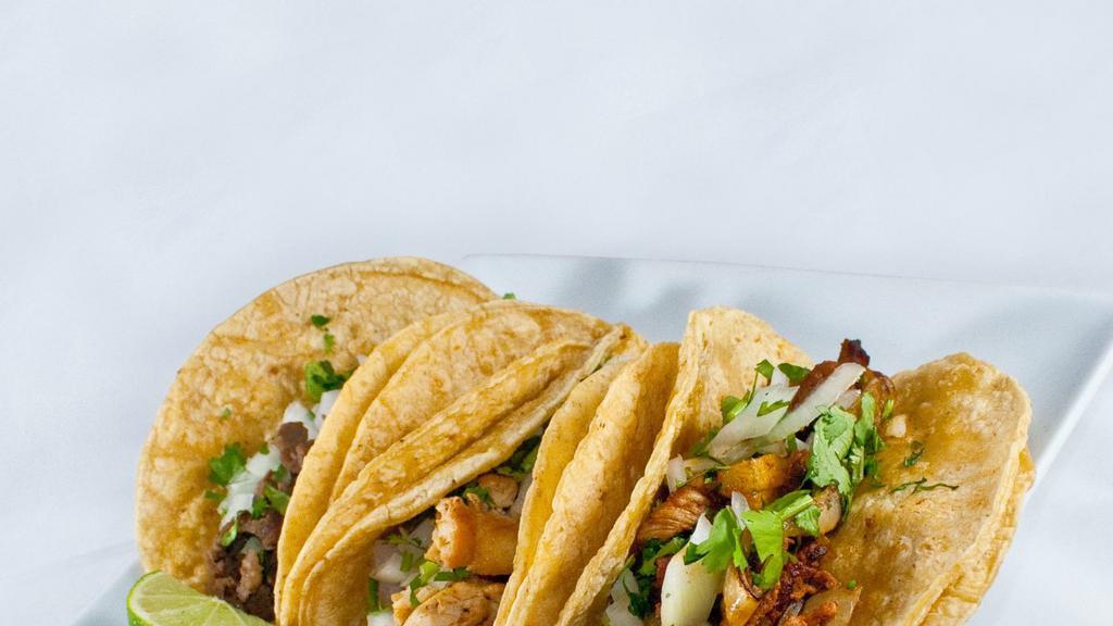 Tacos · comes w/onion &cilantro