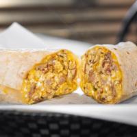 Lisa'S Italian Breakfast Burrito · Scrambled eggs, sautéed onions, cheese blend, and a variety of diced Italian meats including...