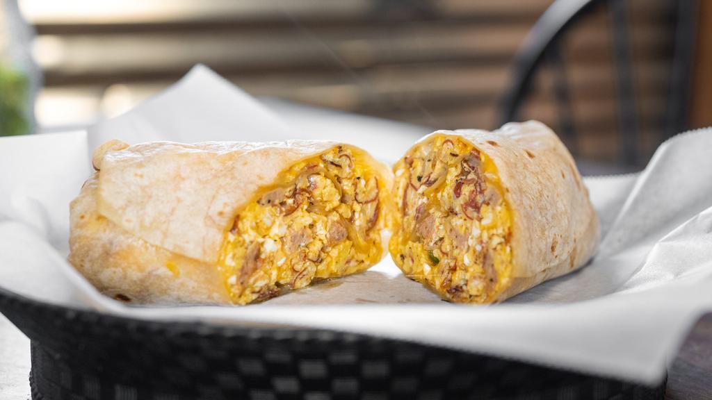 Lisa'S Italian Breakfast Burrito · Scrambled eggs, sautéed onions, cheese blend, and a variety of diced Italian meats including our famous homemade Italian meatballs.
*No alterations can be made to this menu item*