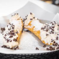 Cannolis · Two pieces. Traditional cannoli shell with sweet creamy ricotta filling and topped with choc...