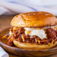 Hot & Wild · The burger consists of a ground beef patty and is topped with a bleu cheese dressing, along ...