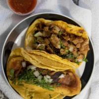 Stuffed Pepper Taco · Soft shell taco served with onions and cilantro.