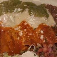 Trio Enchiladas · One beef, one chicken and one cheese with red, green and cheese sauce on top.