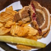 Reuben · Your choice of corned beef or turkey, sauerkraut or coleslaw served on a marble rye bread wi...