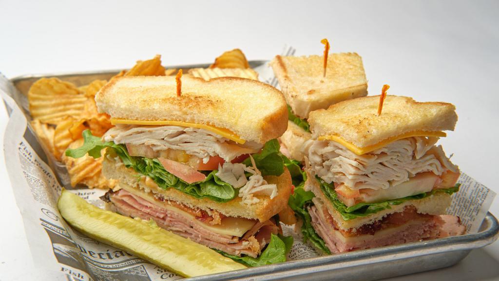 The Den Club · Bavarian ham, roasted turkey, lettuce, tomatoes, thick cut bacon, swiss cheese, American cheese, served on sourdough bread, with 1000 island dressing.