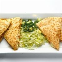 Quesadilla · Mexican blended cheese, tomatoes, onions, fresh jalapeño & lettuce (on side) choice of beef ...