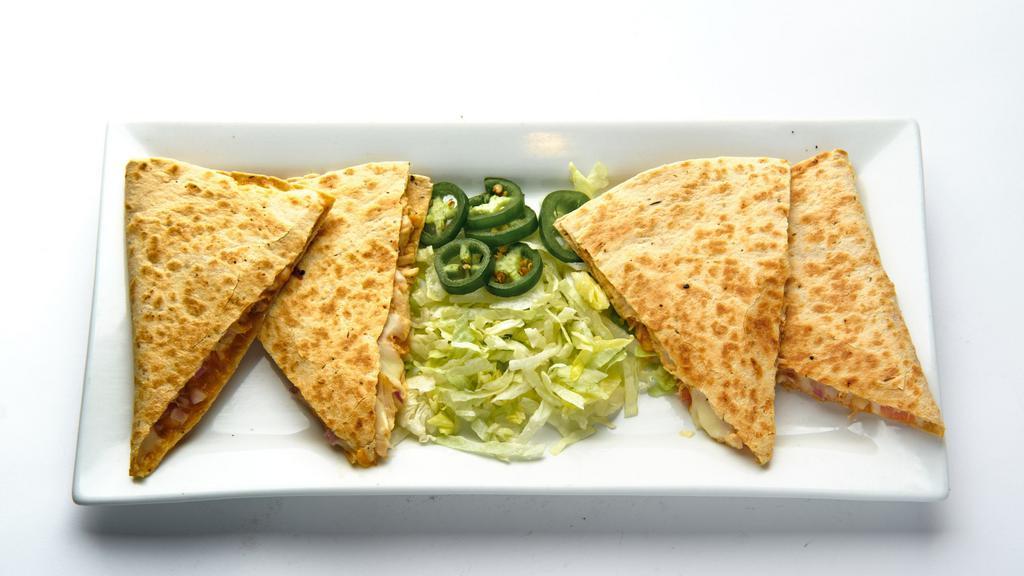 Quesadilla · Mexican blended cheese, tomatoes, onions, fresh jalapeño & lettuce (on side) choice of beef or chicken served with salsa & sour cream. Add Guacamole for an additional charge.