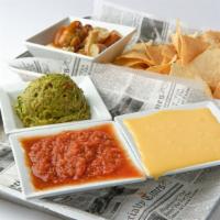 Den Trio · Tortilla chips & Pretzel bites, served with Blue Moon beer cheese, guacamole & salsa.
