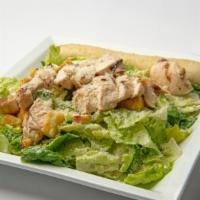 Chicken Caesar · Chicken breast, lettuce, parmesan cheese, croutons, tossed in Caesar dressing.