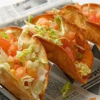 Famous Tacos · (3) deep-fried tacos, cheddar cheese, lettuce, tomatoes, choice of beef or chicken, served w...