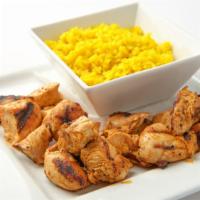 Buffalo Chicken Bites · Grilled chicken chunks tossed in buffalo sauce. Served with yellow rice and steamed broccoli.