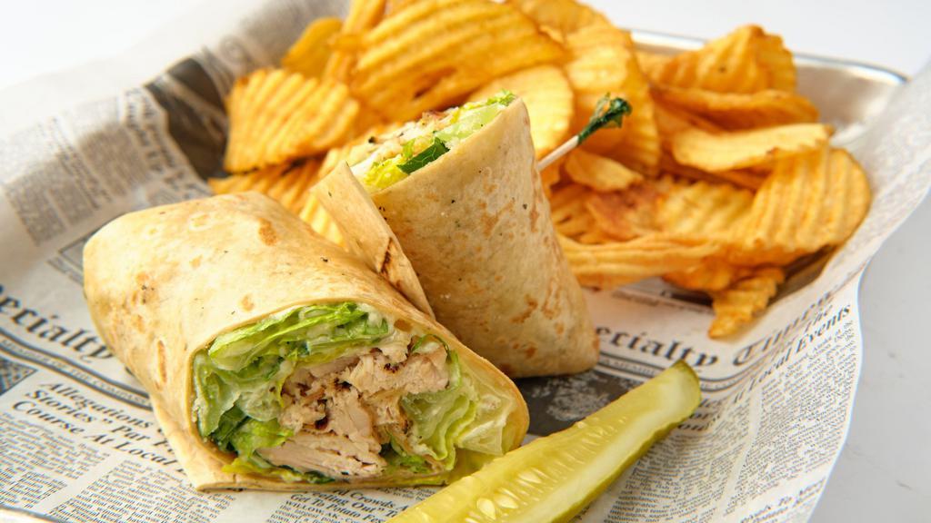 Chicken Caesar Wrap · Grilled chicken breast, romaine lettuce, parmesan cheese, tossed in Caesar dressing, wrapped in a tomato lavash wrap.
