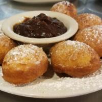 Fried Biscuits · Our delicious fried biscuits, dusted with cinnamon and powdered sugar, with apple butter on ...