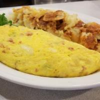 House Omelette · With ham, green peppers, onions, and feta cheese.