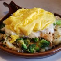 Nomad Skillet · With sliced chicken breast, broccoli, onions, mushrooms, topped with sausage gravy, with Swi...
