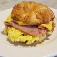 Croissant Breakfast Sandwich · Scrambled eggs, with melted cheese, on a flaky croissant.
