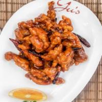 Orange Chicken · Spicy. Big chunks of chicken and orange peels tossed in a sweet yet spicy sauce.