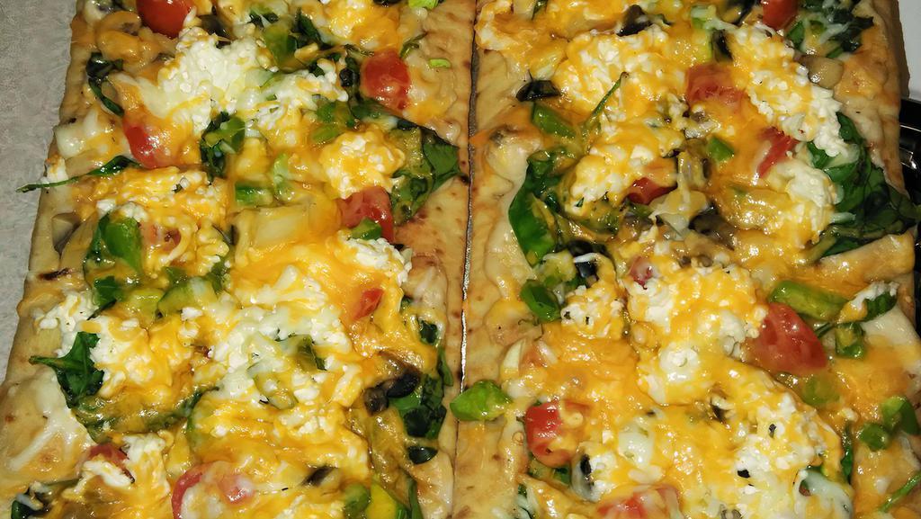 Veggie Pizza · White Sauce or Marinara Sauce

Spinach, Cherry Tomatoes ,Whole Tomatoes, Diced Tomatoes,White Onions, Red Onions, Mushrooms , Pickles, Pineapple , Black Olives, Bell Peppers

Vegetarian Cheese- Cheddar , Mozzarella, Pepper Jack