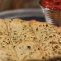 Garlicky Bread Sticks · The best part of our pizza, without the pizza, is the garlicky crust!