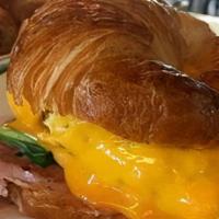 Breakfast Croissant · Choice of bacon, ham, or spinach. // Bagel or croissant sandwich topped with scrambled eggs ...