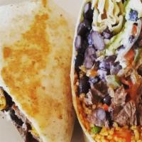 Corazón Burrito · Choice of meat or vegetarian option, black or pinto beans, rice, cheese, avocado, and lime c...