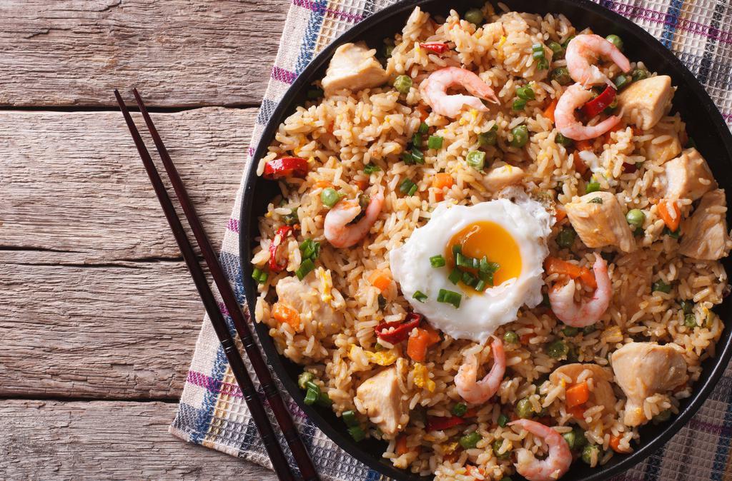House Fried Rice · Delicious mix of chicken, steak, shrimp, and vegetables with fried rice. Served with customer's choice of 2 sauces.