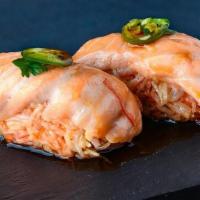 Itchy Salmon (2 Pcs) · baked salmon, spicy crab, serrano, cilantro, ponzu