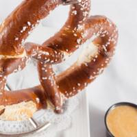 Ginormous Pretzel · We're not kidding, it's big! Served with hot cheese sauce and honey mustard.