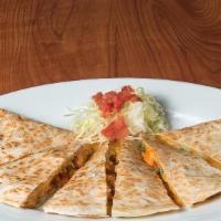 Buffalo Chicken Quesadill · crispy chicken tenders tossed in our homemade buffalo sauce, folded in a flour tortilla with...