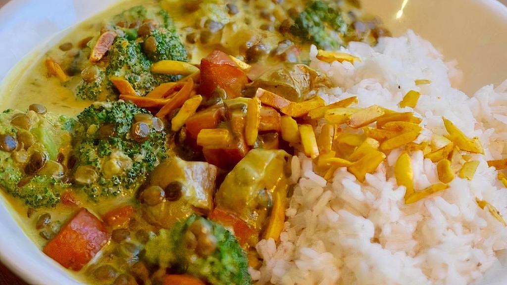 Lentil Curry · Vegan and gluten-free. Potato, carrot, broccoli, coconut milk, basmati rice, spiced almonds.
