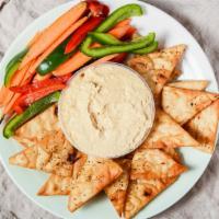 Farmer'S Market Hummus · Our in-house roasted garlic hummus with fresh vegetables from local markets & flash fried ga...