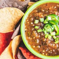Our Fresh Made Chips & Salsa · Fresh made tortilla chips and roasted homemade salsa. Don't miss out.