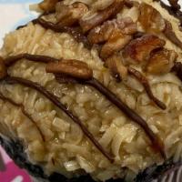 German Chocolate · Rich devil's food cake topped with caramel coconut-pecan frosting, and then drizzled with ga...