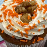Carrot Cake · Cinnamon graham cracker bottom below our moist walnut carrot cake topped with homemade cream...