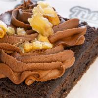 Fudge Walnut Brownie · Our homemade brownie topped
with chocolate fudge icing, and finished with walnuts.